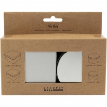 Fyra gråmetallfärgade plåtburkar, två runda och två fyrkantiga, i olika storlekar.