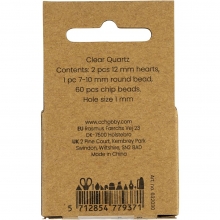 Närbild på transparenta kristallpärlor i klar kvarts.