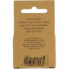 Närbild på ljusgula kristallpärlor i honungskalcit.