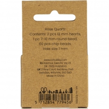 Närbild på rosa kristallpärlor i rosenkvarts.