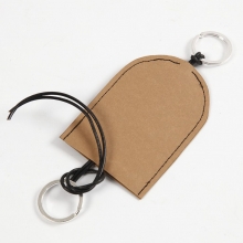 Fodral till nycklar och headset av läderpapper