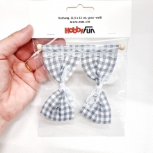 Verklighetstrogna miniatyr gardiner med grårutigt tyg.