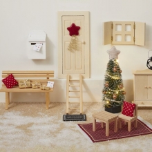 Miniatyr soffkuddar i blå färg med vita prickar.