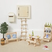 Miniatyr soffkuddar i blå färg med vita prickar.